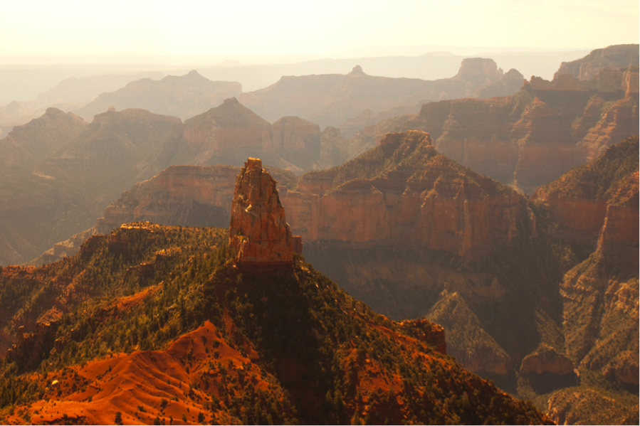 angled morning light illuminates mt. hayden at the north rim of the grand canyon