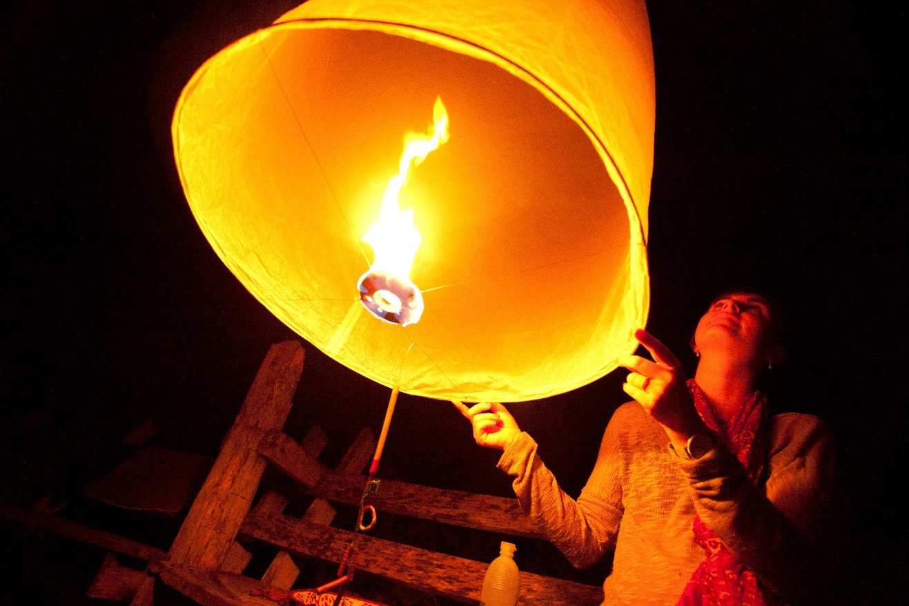 a wide-angle photo of a lantern about to be released in Thailand