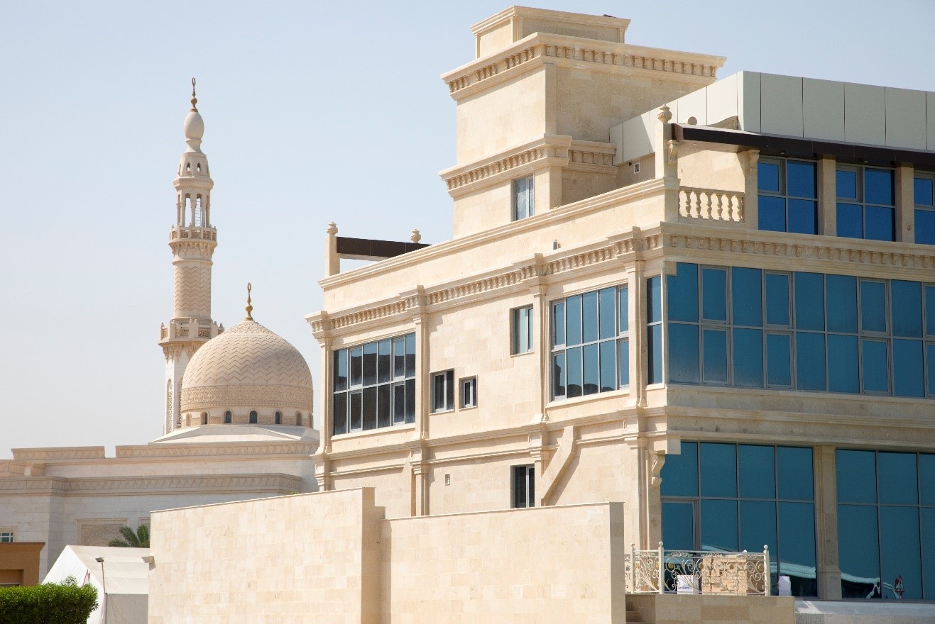 a photo of sandy colored buildings contrasts old and new architecture