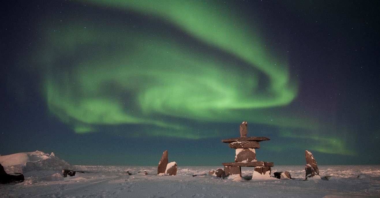 a stunning swirling aurora over the churchill inushuk on the shores of hudson bay