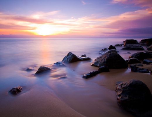 a stunning blue and purple sunset appears over the horizon in madagascar