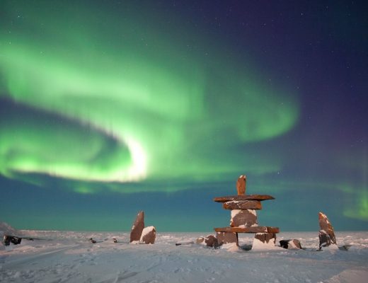 brilliant green northern lights swirl over the hudson bay