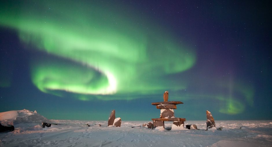 brilliant green northern lights swirl over the hudson bay