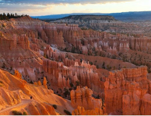 a sweeping view of bryce canyon at sunrise