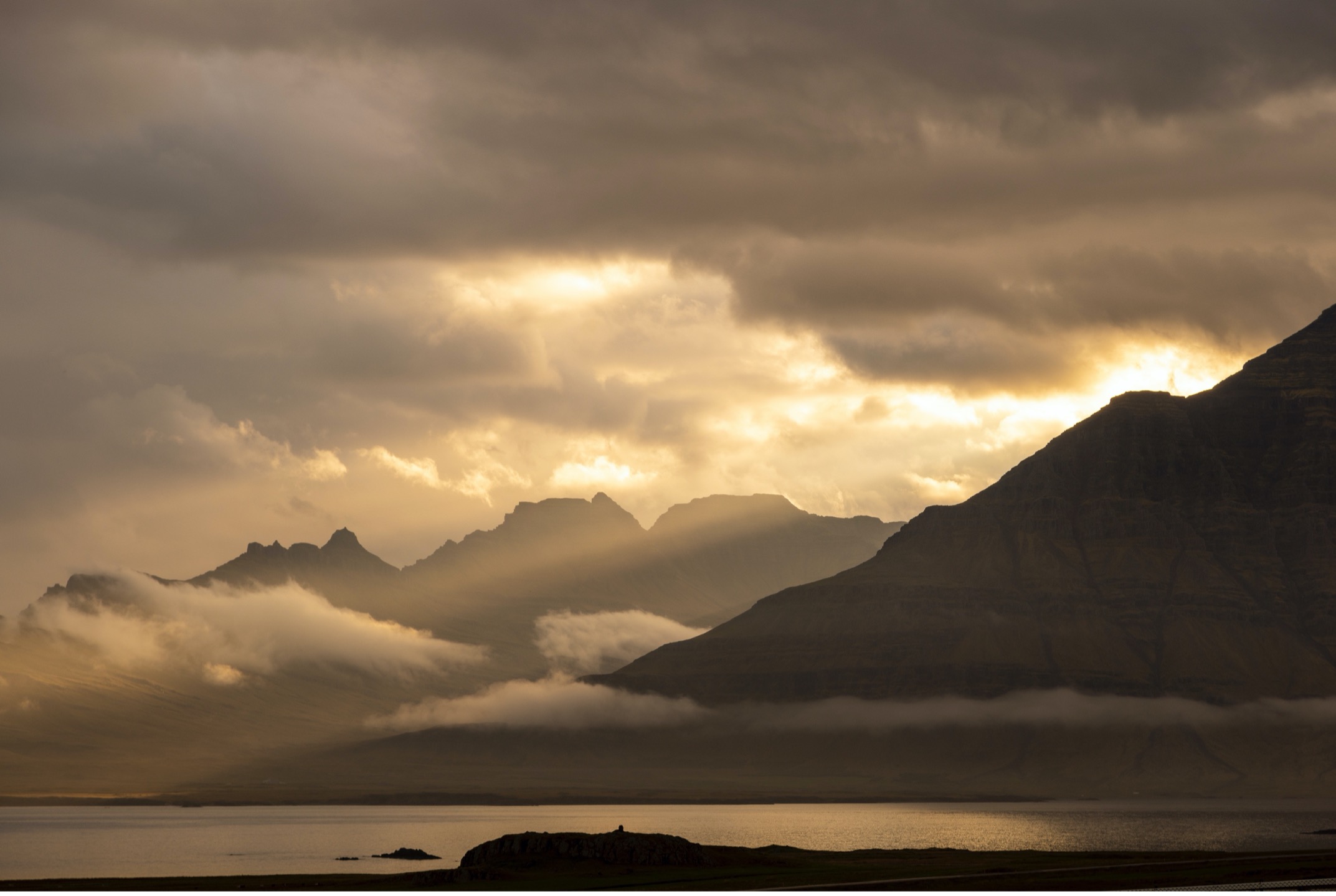 dusk sets in on a fjord in iceland