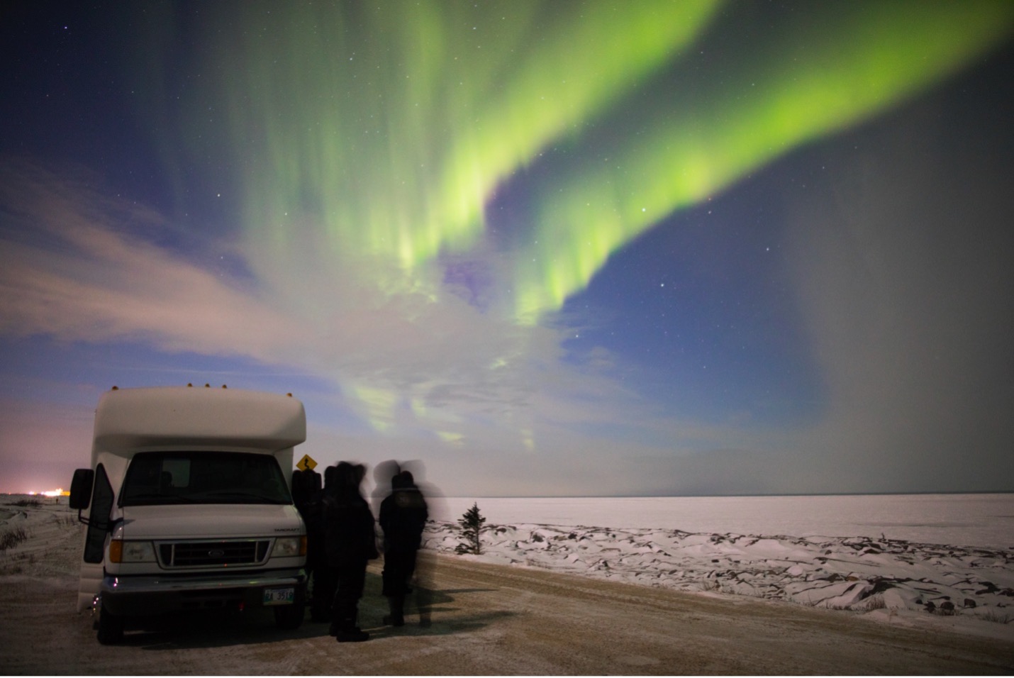 northern lights above the street