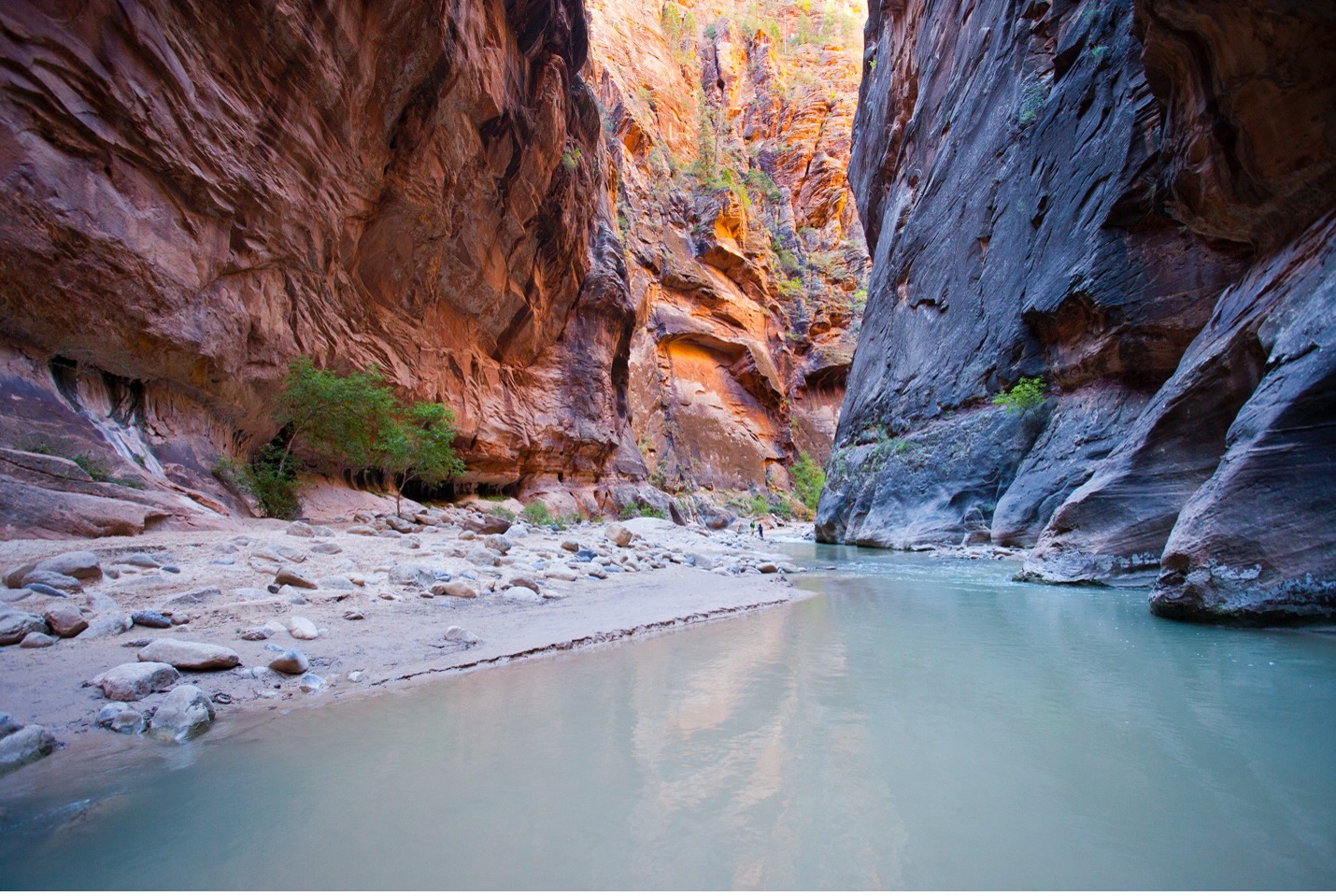 a watery canyon with vibrant colors leading into one another