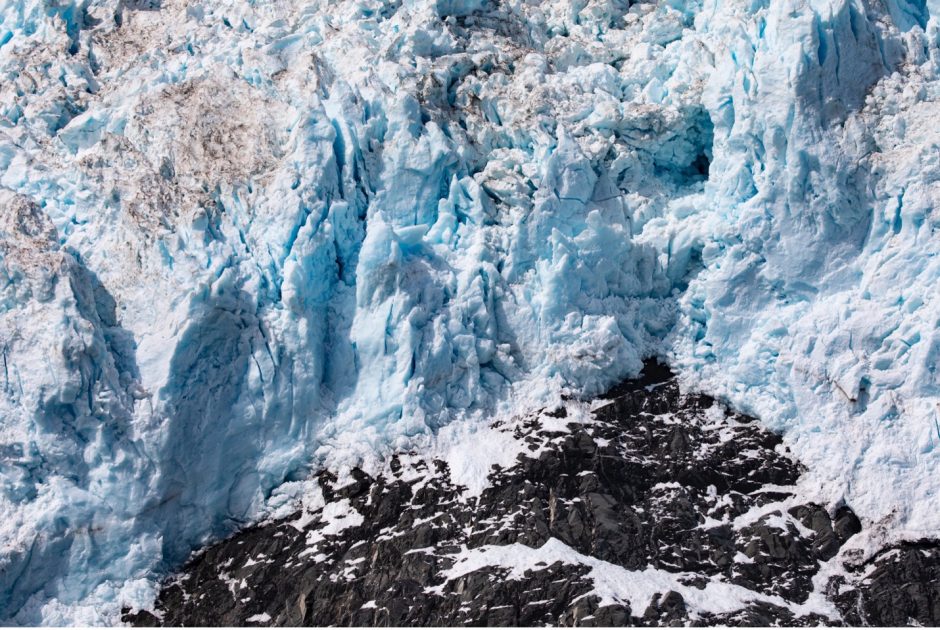 blue glacier above rock