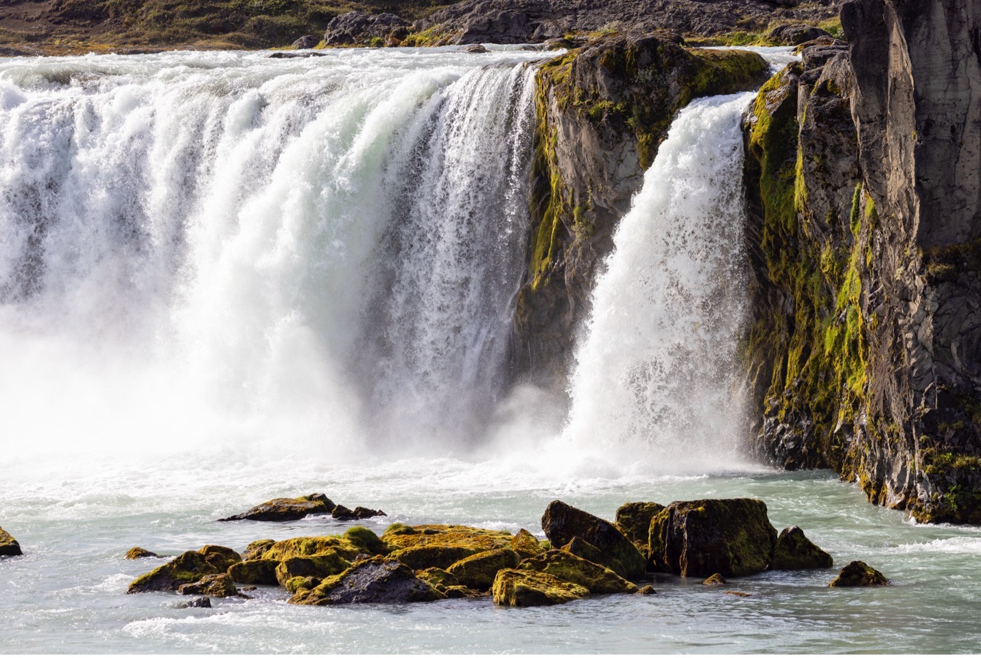 mossy rocks add a foreground element to godafoss waterfall