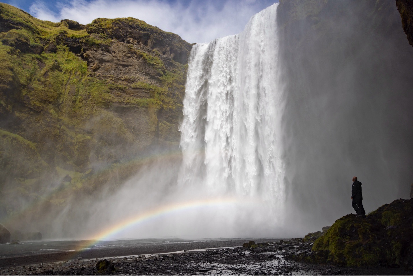 skogafoss makes a traveler look small