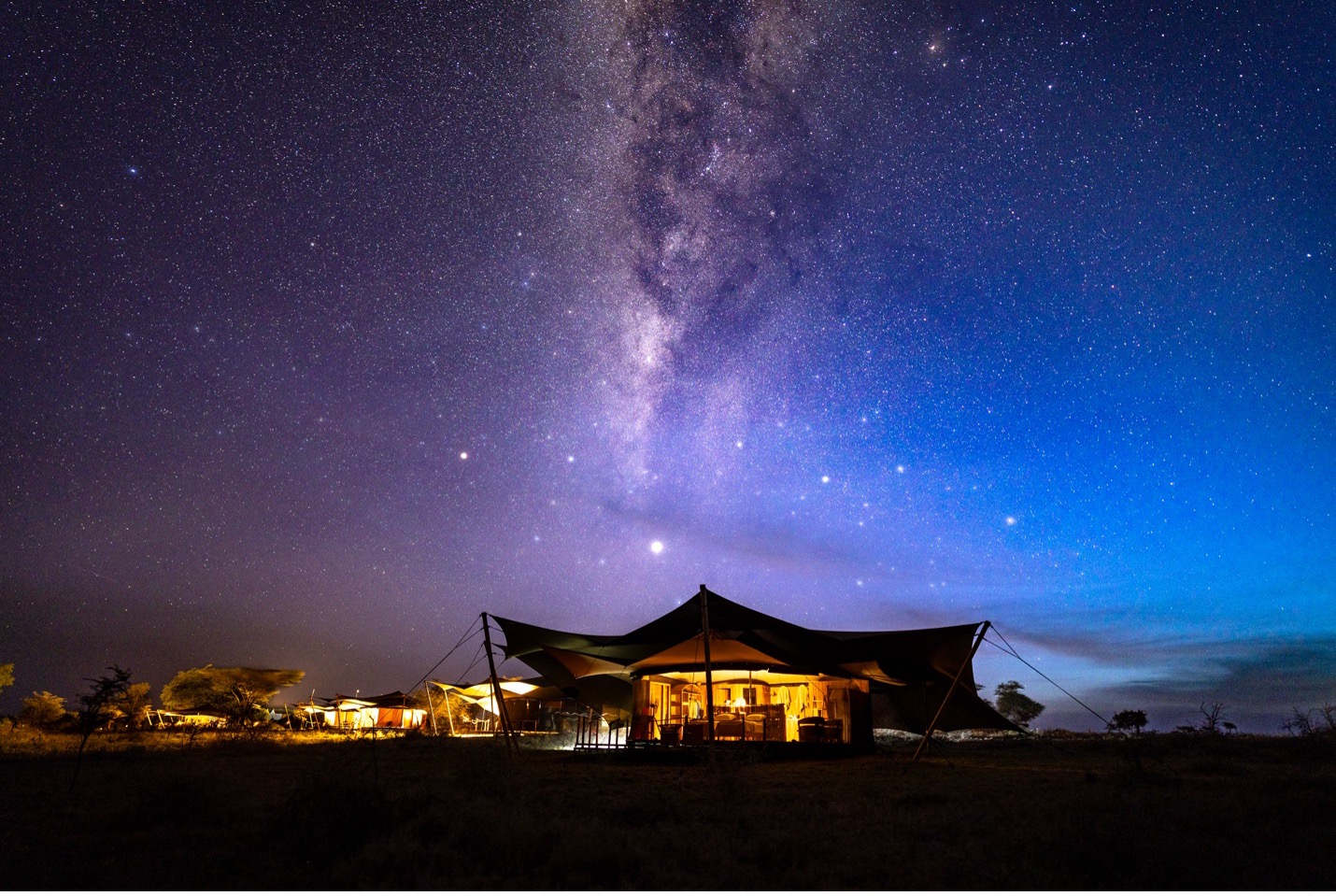 milky way over a camp